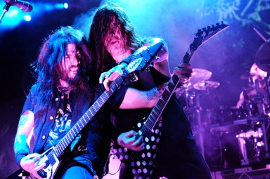 Robb Flynn and Phil Demmel playing each other's guitar in 2012